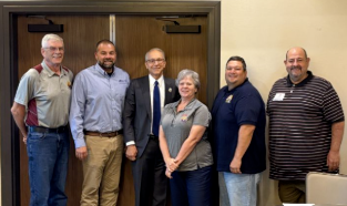 Silhouette of business people negotiating at meeting table Silhouette of business people negotiating at meeting table board of directors stock pictures, royalty-free photos & images